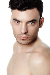 Obraz premium Charming and handsome man face over a white background