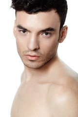 Charming and handsome man face over a white background