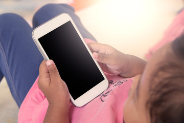 kid's hands hold smart phone,tablet,cellphone for playing and ed