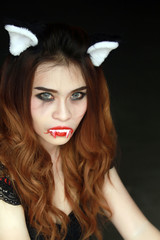 Beautiful Young woman as sexy vampire - halloween portrait