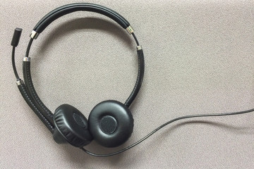 Wire Headset at Corner on Gray Textile Background used as Template