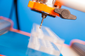 Cutter CNC router and plastic parts of Plexiglas