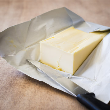 Butter Bar on Wrapping Paper with a Knife