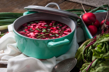 Beetroot soup with chives and radishes