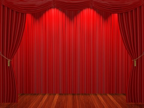 Stage with red curtains and spotlight.