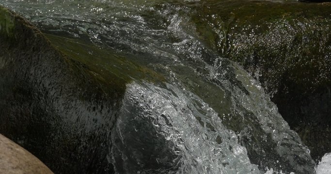 4K, abstract flowing and splashing water closeup