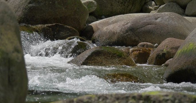 4K, abstract flowing and splashing water closeup