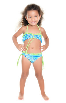 Cute small hispanic girl wearing a swimsuit