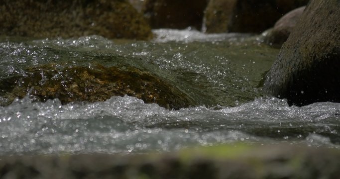 4K, abstract flowing and splashing water closeup