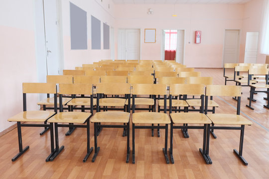 Rows of wooden chairs in the hall