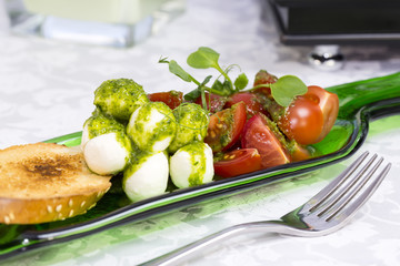Caprese salad with tomatoes and cheese