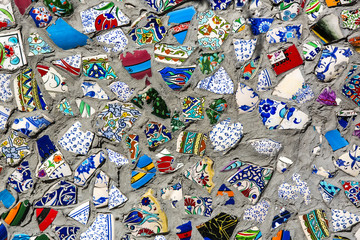 Obraz premium wall with broken ceramic plates colored fragments