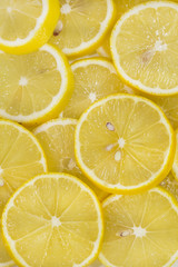background of sliced ripe lemons organic, pattern