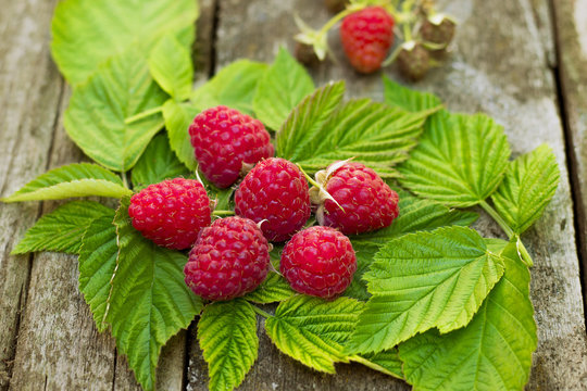 Raspberries on the Old Wooden Table