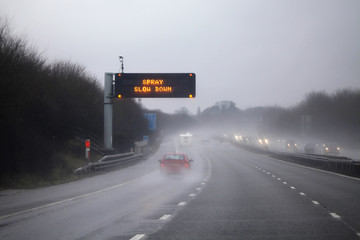 Rain on the highway / road - adverse driving conditions.