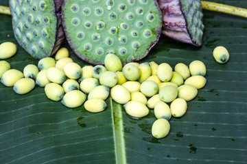 Lotus seed on banana leaf © nawin