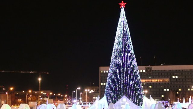 PERM, RUSSIA - JAN 15, 2015: Christmas tree with illumination in Ice Town at night. Cost of construction and maintenance of town - 583 000 dollars
