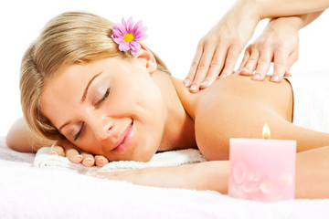 Obraz na płótnie Canvas Young woman having massage on spa treatment