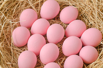pink egg in basket