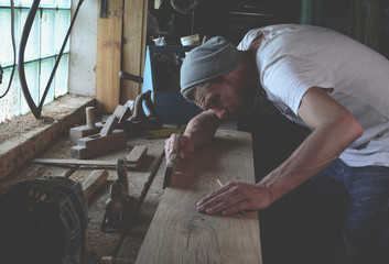 Woodworker while working in the studio
