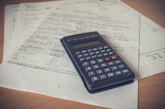 Calculator over a bank financial statement