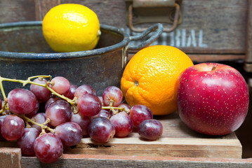still life of fruit on vintage wood background
