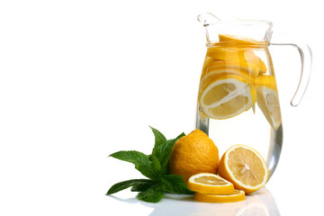 Lemonade in a jug on a white background isolated