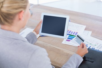  Businesswoman holding tablet and credit card