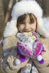 Little girl holding snow