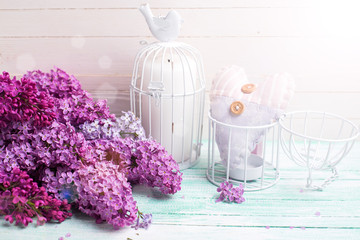 Background with  lilac flowers and candle and heart