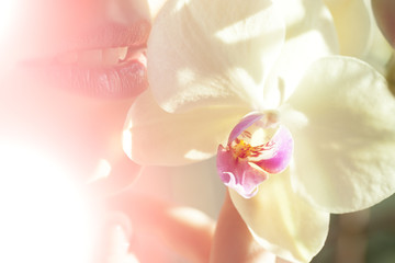 Fototapeta na wymiar Female lips and orchid