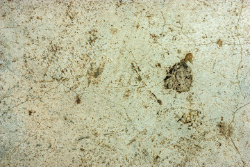 Cement floors are old and dirty.