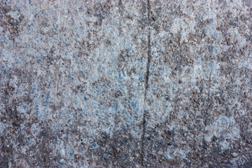 Cement floors are old and dirty.