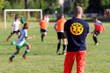 Medical rescuer for a football game of young boys