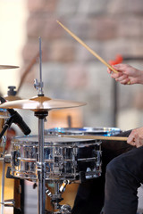 Musician playing the drums at the concert