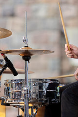 Musician playing the drums at the concert