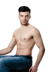 Fototapeta premium Healthy muscular young man. Isolated on white background