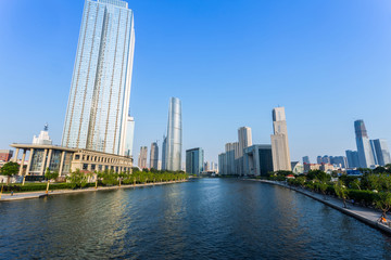 Obraz premium Modern buildings and river in urban city