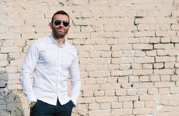 portrait of a handsome young man with sunglasses