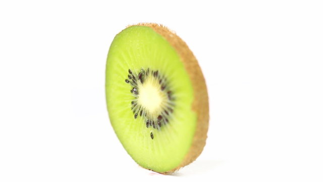 Kiwi close up - Fresh kiwi slice rotating in a seamless loop