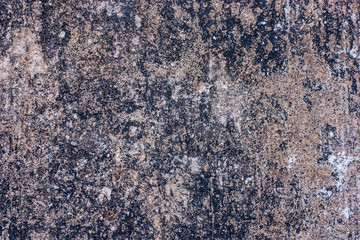 Textured walls with dirt.