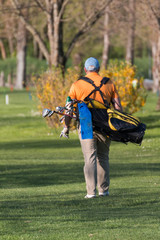 Fototapeta na wymiar Chubby Man with Golf Bag