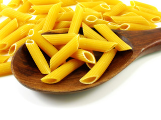 italian penne rigate macaroni pasta raw food background or