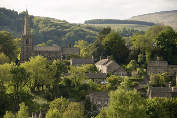 Naklejka premium Hathersage village and church nestled in the rolling hillsides of the Peak District, Derbyshire UK