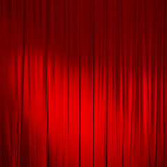 Red closed curtain with light spots in a theater