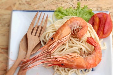 Pasta spaghetti with shrimp on the plate.