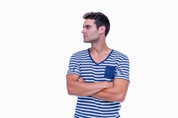 Fototapeta premium Handsome hipster looking away with arms crossed