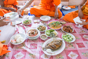 food and drink for monks in traditional religious ceremony in a temple , Thailand.