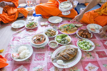 food and drink for monks in traditional religious ceremony in a temple , Thailand.