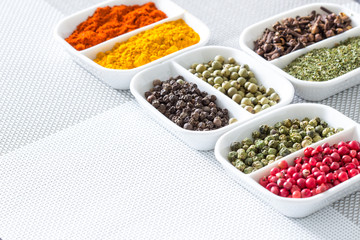 Colorful herbs,spices and aromatic ingredients on modern table.
